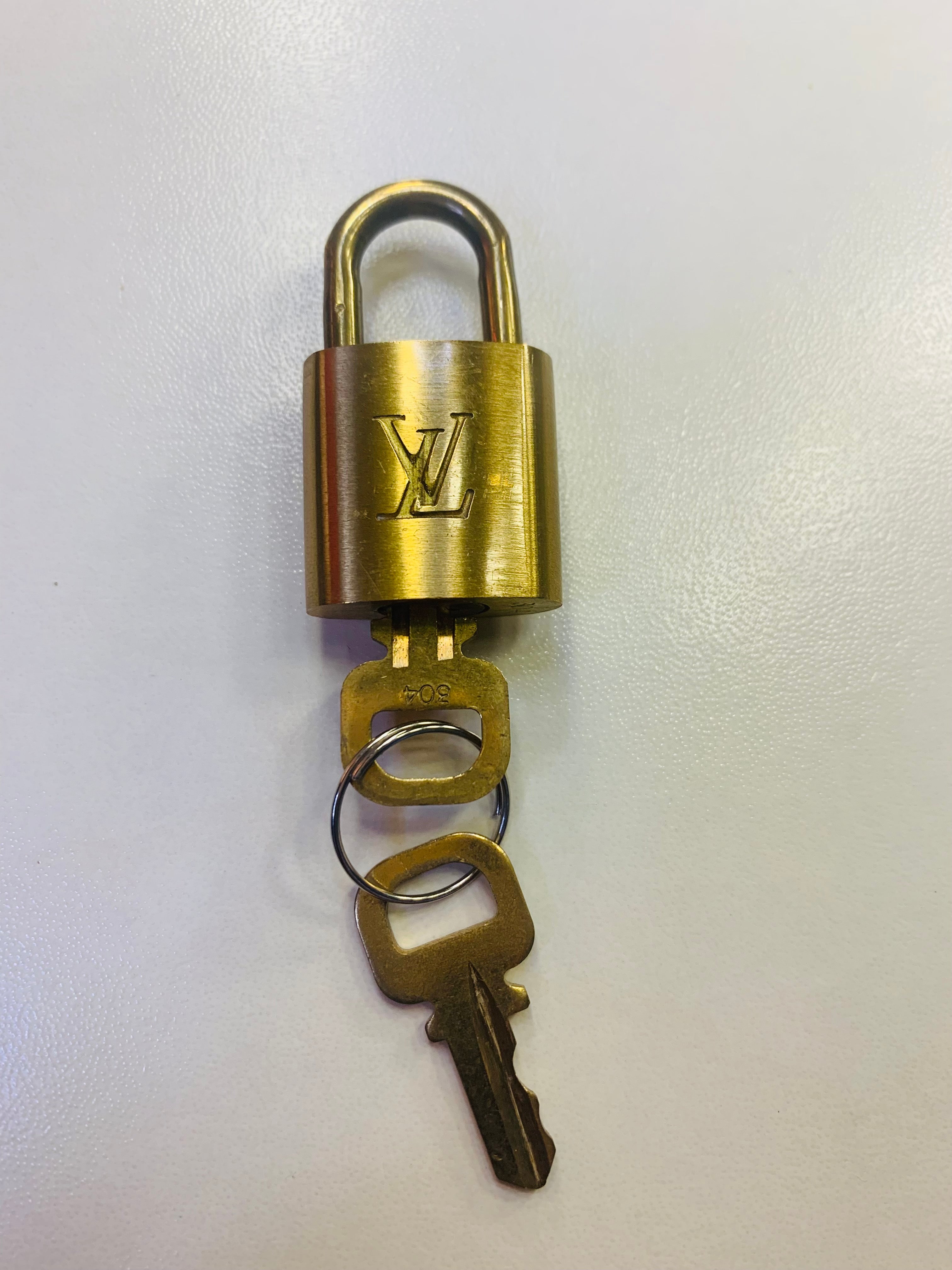 Authentic Louis Vuitton Gold Lock With 2 Keys Bag